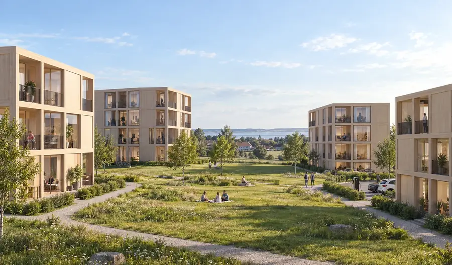 Timber apartment buildings around a green courtyard
